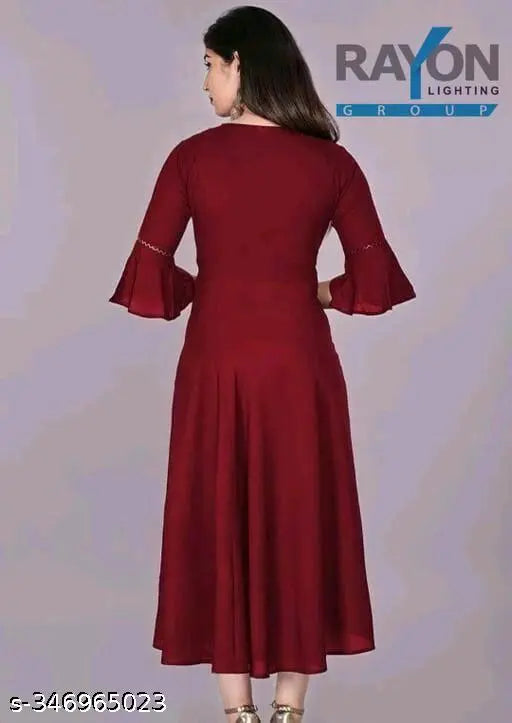 Maroon rayon round neck kurti for women, casual & festive wear under 300 Rs. Solid design with three-quarter sleeves