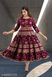 Maroon rayon anarkali gown with three-quarter sleeves and printed pattern, perfect for women's casual or regular wear. Size M (bust 38 in, length 48 in), L (bust 40 in, length 48 in), XL (bust 42 in, length 49 in), XXL (bust 44 in, length 49 in). Indian-designed women's clothing for a stylish and comfortable fit