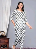 Black cotton printed night suit top and pyjama coord set for women, featuring three-quarter sleeves and stylish print design. Made from soft cotton fabric for comfort. Available in sizes S, M, L, XL, XXL, XXXL. Co-ord sets ideal for daily, casual, formal, and party wear. Origin: India