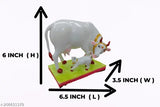 White marble Kamdhenu cow and calf statue, intricate detail and realistic design for home decor or showpiece