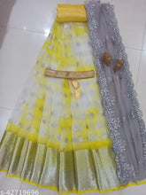 Trendy South Indian style yellow organza lehenga, choli & dupatta set (un-stitched). Embroidered, soft silk top, organza bottom, net dupatta in unstitched sizes with belt included. Indian-made traditional wear on display