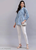 Blue viscose kurti with long sleeves and printed blue flower pattern, popular Indian women's fashion on mannequin
