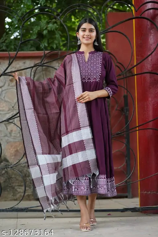 Rayon Anarkali gown with printed net, three-quarter sleeves, embroidered detailing. Indian ethnic fashion for women