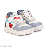 Grey synthetic leather Kids Jordans, colorblocked style with PVC sole. Durable children's shoes on display." (107 characters)