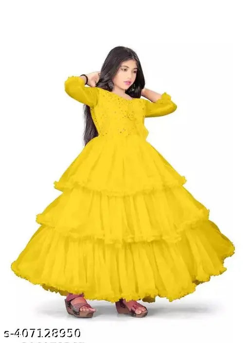 B.R. Enterprise children's dresses - net fabric, three-quarter sleeves, solid pattern for special occasions. Perfect for kids aged 5-16 years. Indian made