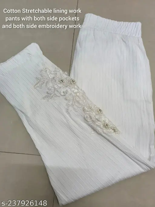 Cotton stretchable lining pant with both side pockets, hand-embroidered net design in white