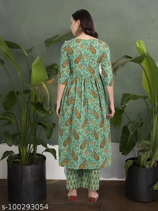 Green cotton casual kalamkari-printed kurta set with matching palazzos, three-quarter sleeves, round neck, pompom detailing