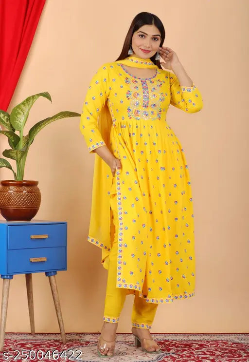 Yellow rayon embroidered kurta pant dupatta set (Naira Cut), indigo multi-colored with round neck and floral print, ethnic pant with printed border cut & sew. Traditional Indian fusion wear for contemporary women