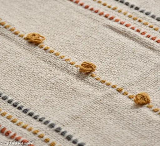 Handwoven 100% cotton throw, natural color palette, artisanal craftsmanship, generous size (52x70 inch), soft and breathable. Indian-made, sustainable home decor accessory on display