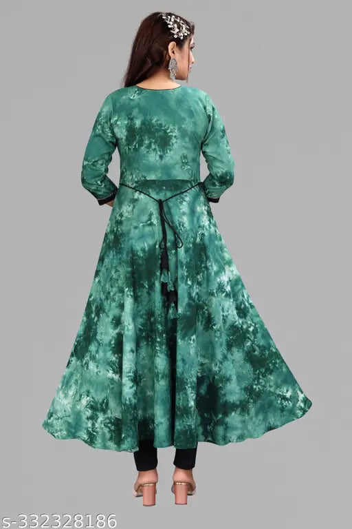 Green rayon Anarkali Kurti with patched design, full ghera style, three-quarter sleeves. Perfect for office or important occasions. High-quality materials ensure comfort and versatility for various outfits. Made in India