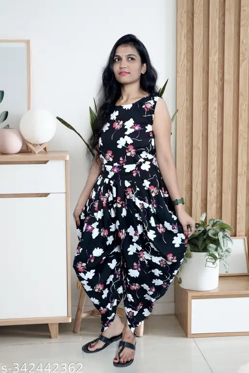 Black crepe dhoti jumpsuit with printed net pattern, sleeveless and available in sizes S-XL. Indian ethnic wear