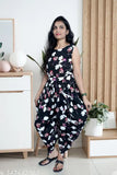 Black crepe dhoti jumpsuit with printed net pattern, sleeveless and available in sizes S-XL. Indian ethnic wear