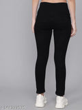 Stretchable black denim slim women's jeans with 5-pocket styling and mild distress, perfect for casual occasions