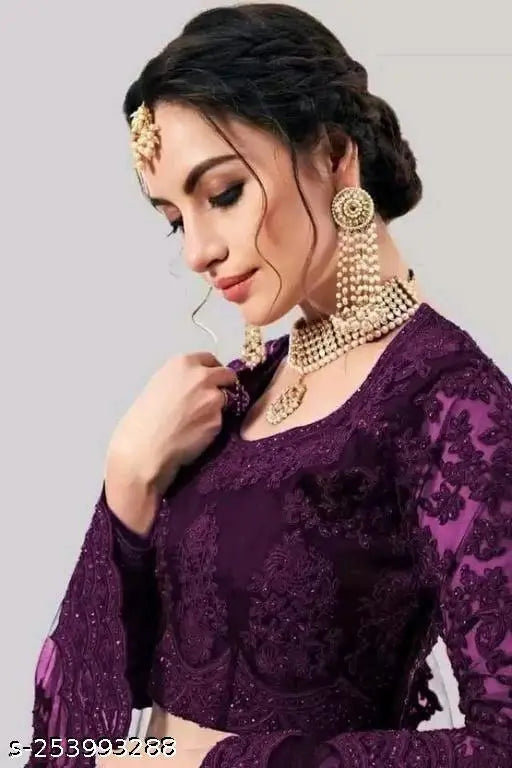 Semi-stitched net lehenga choli set for women, embroidered bridal party wear. Indian traditional fashion for special occasions