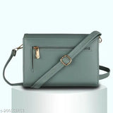 Green faux leather sling bag, 4 compartments, card slots & zipper pocket. Indian-made trendy accessory for modern women