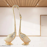 Metal swan pair set for home, temple, or office decoration, Feng Shui showpiece with dimensions: 5 cm (L) x 18 cm (H) x 4 cm (B). Handcrafted in India
