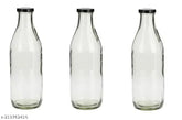 Clear glass serving bottles with metal lids (pack of 3), perfect for oil, milk, spices, and more. Somil's stylish kitchen storage solution. Made in India