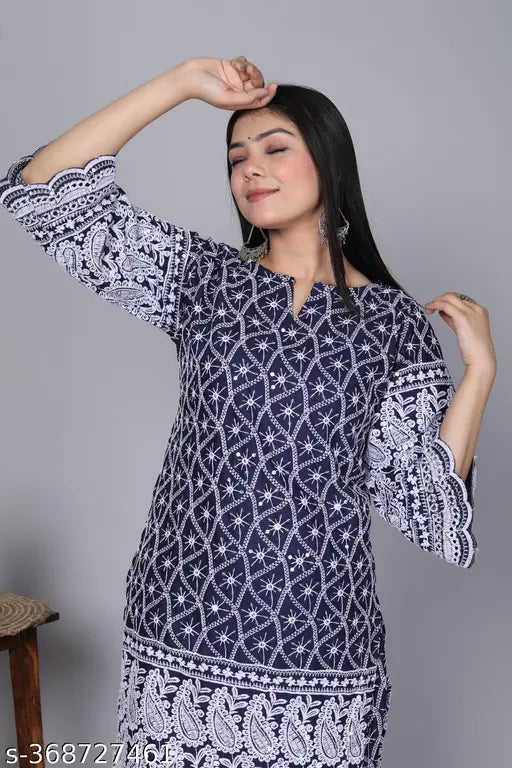 Designer DM Chikankari set, cotton blend kurta & pants with three-quarter sleeves, printed net pattern, single size available. Hand-embroidered Indian garment featuring intricate floral designs on lightweight breathable fabric