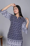 Designer DM Chikankari set, cotton blend kurta & pants with three-quarter sleeves, printed net pattern, single size available. Hand-embroidered Indian garment featuring intricate floral designs on lightweight breathable fabric