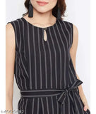 Black printed crepe sleeveless waist-tie jumpsuit, boat neck style on model