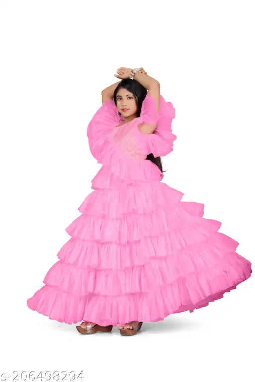 Stitched net gown for kids and young girls, solid color, perfect for festive occasions like Navratri/Diwali, Raksha Bandhan, Christmas, New Year. Elegant style with statement earrings and high heels, dry clean only. Sizes: 4-5 Years, 5-6 Years, 6-7 Years, etc., up to 15-16 years. Made in India