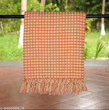 Orange beige waffle throw with floral border, check pattern on 50" x 70" cotton net