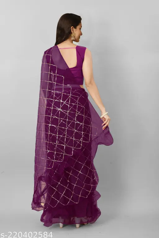 Heavy net sari with checkered blouse, featuring 3mm gold sequence work and free lace border. Indian-made, single size (saree length - 5.5m, blouse length - 0.8m)