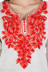 Hite embellished Aari work wool kurti for women, three-quarter sleeves, vibrant multi-color embroidery on woolen fabric