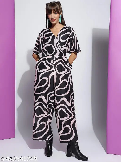 Women's poly blend printed V-neck half-sleeve western jumpsuit in Rama, Pink, Black, or Orange. Versatile and stylish, featuring western motifs on wrinkle-resistant, breathable fabric. Size S to XXL