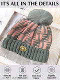 Grey striped woolen knitted cap with fur inside for women & girls. Soft, warm, and stylish winter accessory