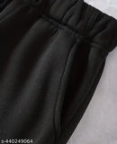 Black polycotton women's joggers with elastic waistband, deep side pockets. Ideal for sports, gym, or running. Comfortable wear for winters