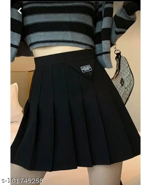 Cotton solids solid-color pleated mini skirt for women and girls, high waist tennis skater style from Caracola