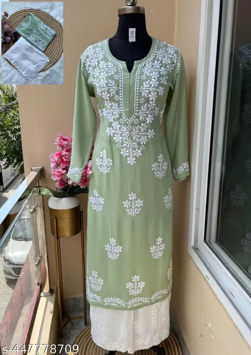 Embroidered rayon kurta and palazzos with three-quarter sleeves, Chikankari work on net background. Single set for M (38in bust, 16in shoulder), XXXL (46in bust, 20in shoulder), 4XL (48in bust, 21in shoulder), 5XL (50in bust, 22in shoulder), and 6XL (52in bust, 23in shoulder). Indian handcrafted traditional outfit