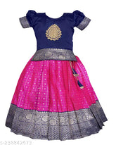 Taffeta Silk pattu pavadai lehenga choli for girls in traditional South Indian style, embellished with acrylic dupatta and short sleeves