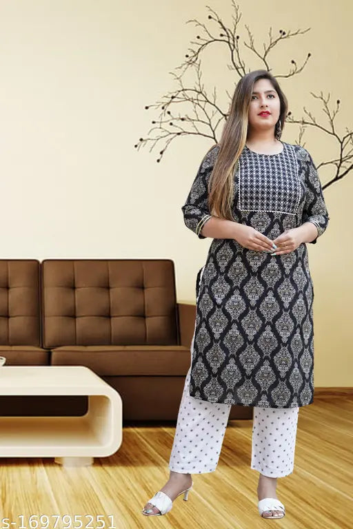 Multicolor printed cotton kurta and palazzo set for party, wedding, office, or casual wear. 3/4 sleeve length, round neckline, suitable for women's wardrobe