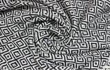 Black & White Cotton Argyle Throw, geometric pattern, perfect for all-season use, enhances sofa style, 60x50 inches, versatile usage, easy to clean