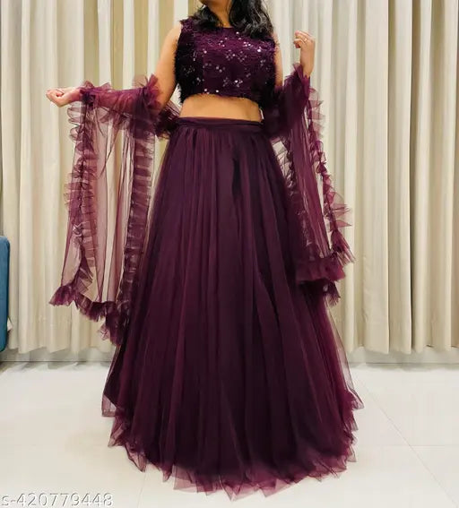 Wine-colored net lehenga choli set, featuring jute silk top and net bottom, ethnic motif pattern. Indian handcrafted women's and girls partywear, trendy and fashionable with dupatta