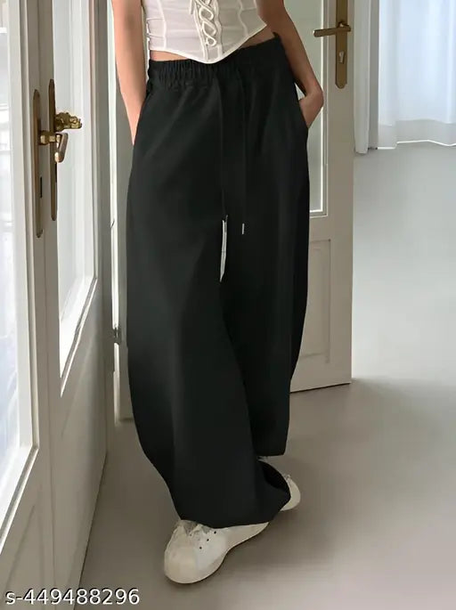 Straight fit black joggers with pockets, solid net fabric for women's sleepwear. Made in India