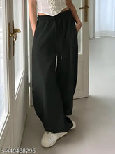Straight fit black joggers with pockets, solid net fabric for women's sleepwear. Made in India