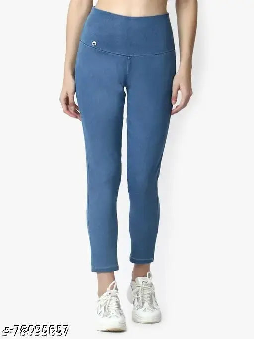 Blue denim jeggings or jeans, solid-colored denim for women's casual wear on model