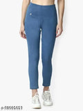 Blue denim jeggings or jeans, solid-colored denim for women's casual wear on model