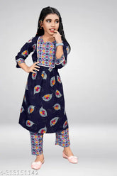 Girls Cotton A-line flared dress kurta and trousers set, printed with festive party designs. Ideal for weddings, functions, and occasions. Size range: 6-7 Years - 13-14 Years. Origin: India