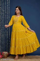 Super yellow rayon kurta with four-tier embroidery, three-quarter sleeves, printed pattern. S (36in bust, 42in length), M (38in bust, 42in length), L (40in bust, 42in length), XL (42in bust, 42in length), XXL (44in bust, 42in length), XXXL (46in bust, 42in length). Indian traditional clothing on display
