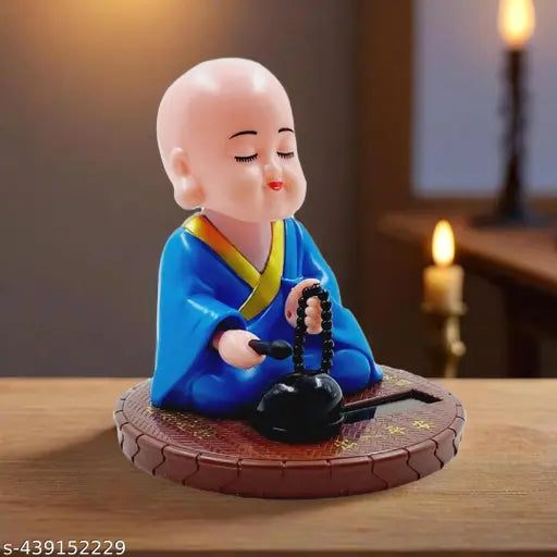 Solar-powered blue round base Gautam Buddha statue, hand sitting design for home/office decor, symbolizing wealth & prosperity