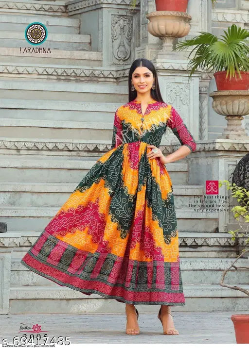 Cotton Anarkali gowns, three-quarter sleeves, vibrant badhani print. Indian traditional wear on mannequin