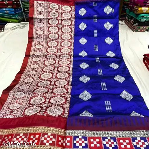 Royal blue Sambalpuri silk saree with floral buta allover pattern, ideal for Odisha pujas and traditional celebrations