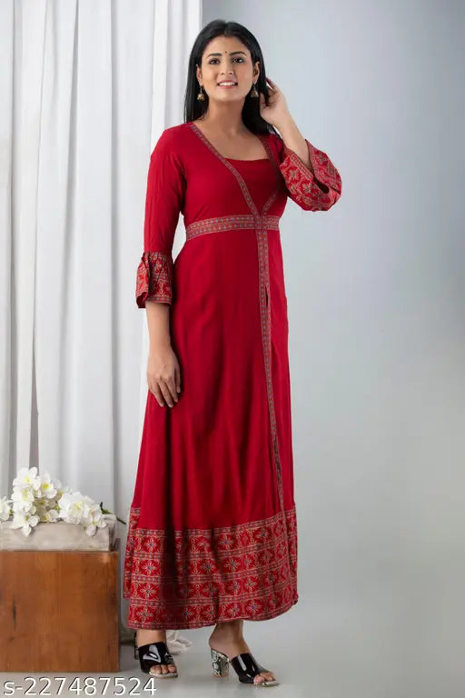 Maroon rayon frontslit kurta with three-quarter sleeves, solid design. Lightweight ethnic wear from India