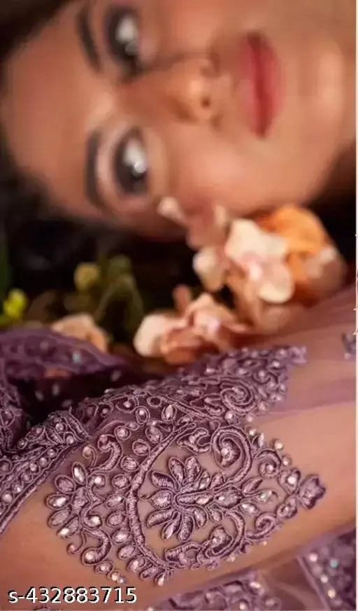 Purple embroidered lehenga set: net topwear & bottomwear, intricately embroidered dupatta. Traditional semi-stitched design for custom fit, suitable for girls and women. Indian bridal wear