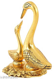 Golden brass pair of kissing swan figurines for home decor, symbolizing love and positivity