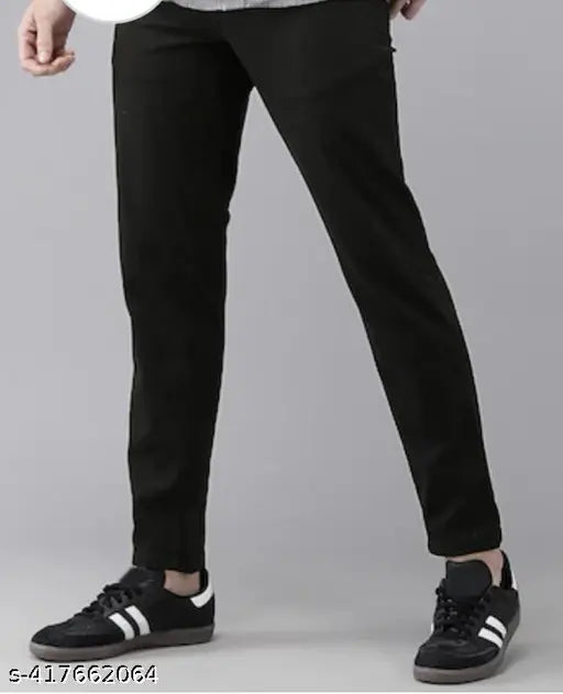 Trendy men's cotton mid-rise black jeans, slim fit and dyed/washed for a modern look. Style with a comfortable waist size of 28, 30, or 32 inches. Made in India